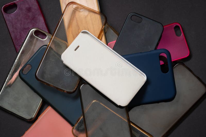 Pile of Multicolored Plastic Back Covers for Mobile Phones on Black