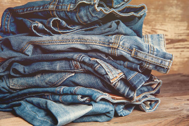 Pile of Old Indigo Jeans Denim on Wooden Table Stock Image - Image of ...