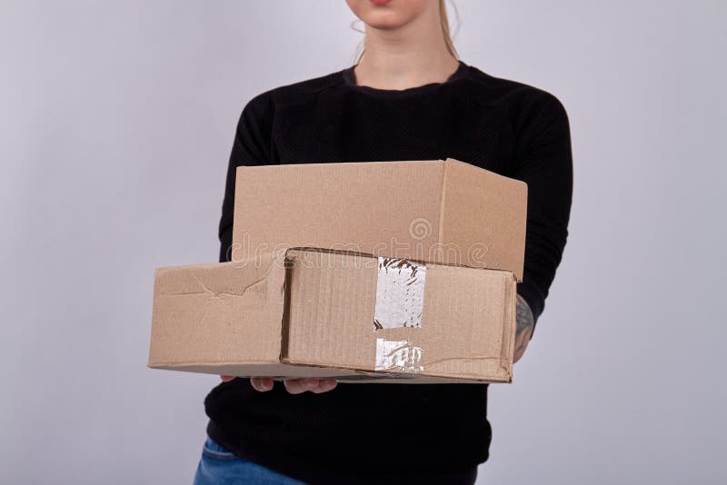 Pile of Parcels in the Hands of Delivery Box. Stock Photo Image of