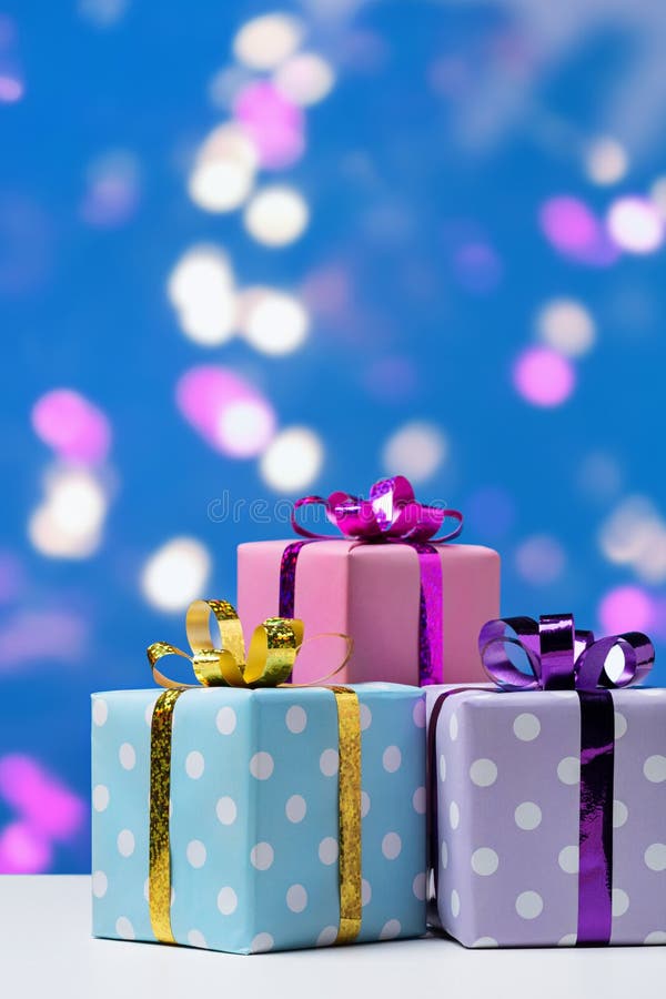 Many Gift Boxes on Blue Background. Stock Image Image of gift, bokeh