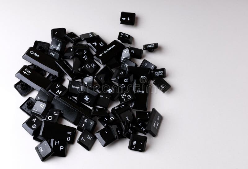 A pile of random computer keyboard keys on a white background stock image
