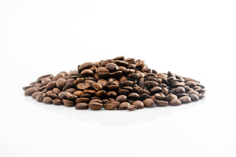 A Pile of Roasted Coffee Beans on a White Background Stock Photo