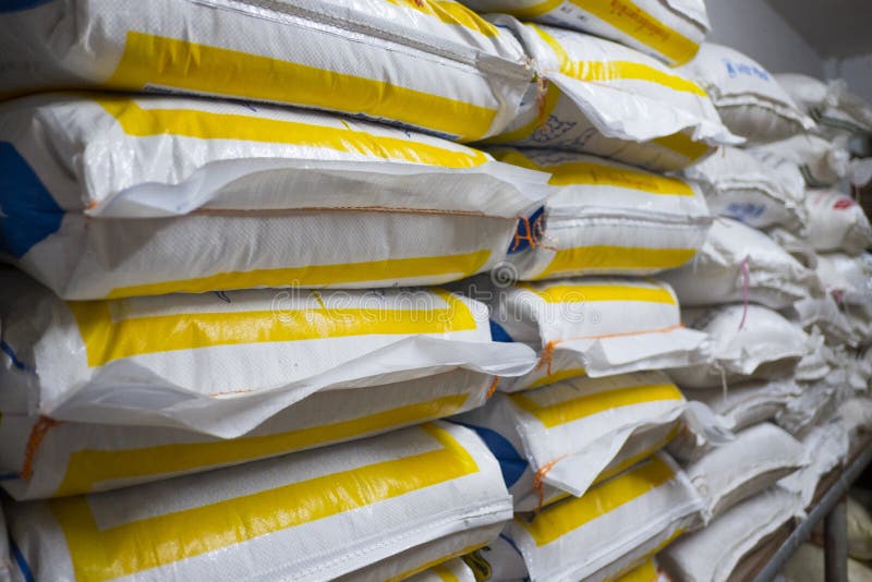 Pile of sack in warehouse. Background and texture of sack stack royalty free stock photo
