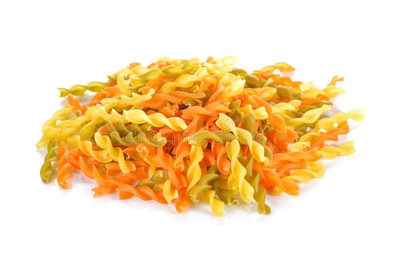 Pile of small vegeroni Rotini spirals pasta on white background stock images
