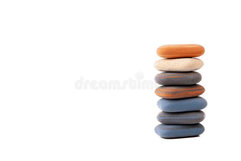 A pile, stack, tower of spa stones, simple treatment zen scene abstract symbol, copy space background. Rubber like zen pebbles royalty free stock photography A pile, stack, tower of spa stones, simple treatment zen scene abstract symbol, copy space background. Rubber like zen pebbles royalty free stock photography