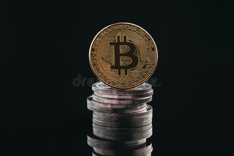 Pile of stacking coins with golden bitcoin on top, king of all c royalty free stock photography