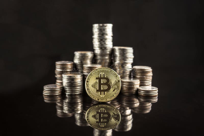 Pile of stacking coins with golden bitcoin on top, king of all c royalty free stock photography