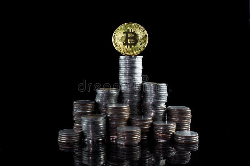 Pile of stacking coins with golden bitcoin on top, king of all c royalty free stock photo