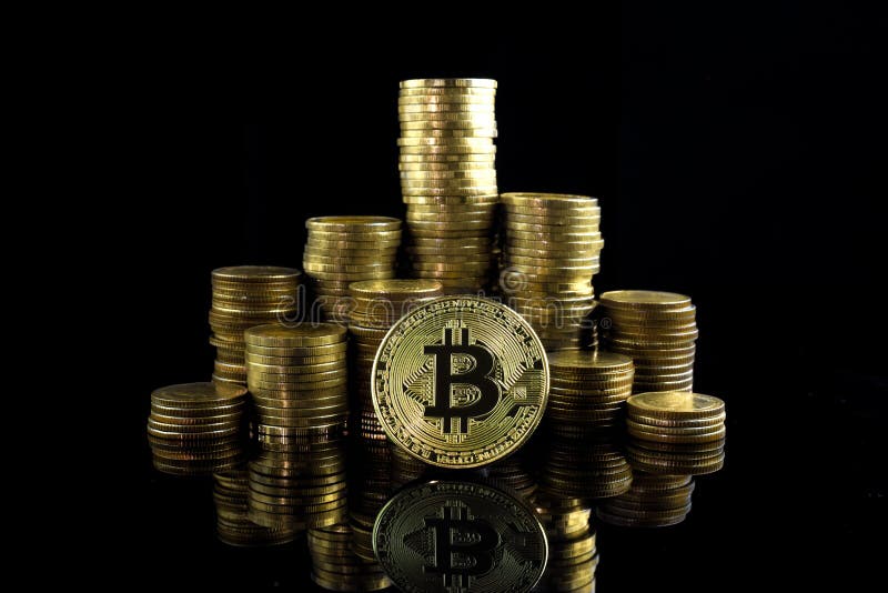 Pile of stacking coins with golden bitcoin on top, king of all c stock photography