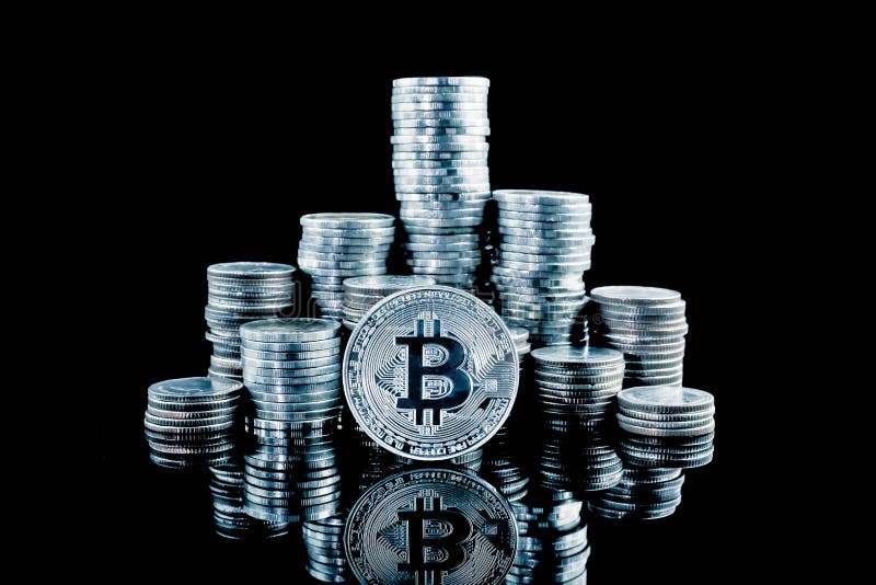 Pile of stacking coins with silver bitcoin on top, king of all c stock photo