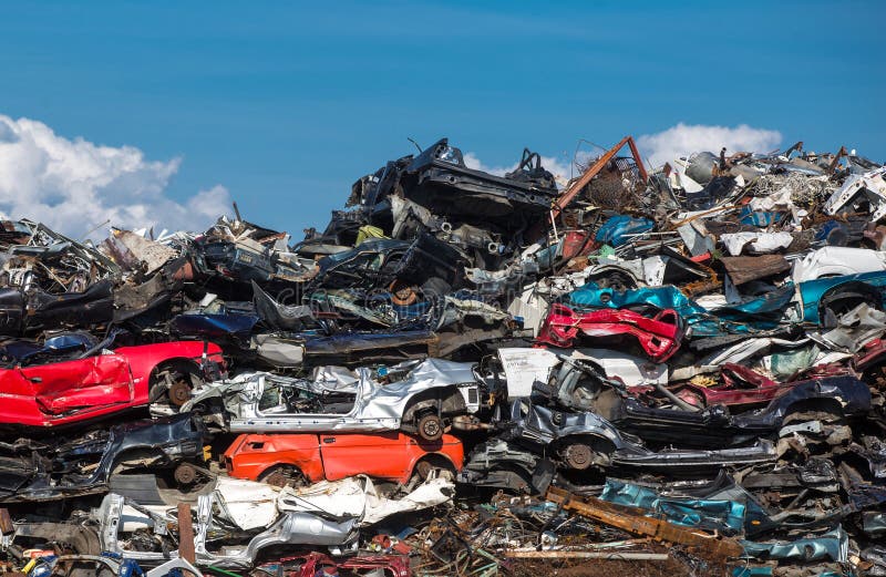 Old rusting cars in a junk yard. Old rusting cars in a junk yard