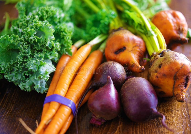 Pile of veggies with carrots, beets and kale stock images Pile of veggies with carrots, beets and kale stock images