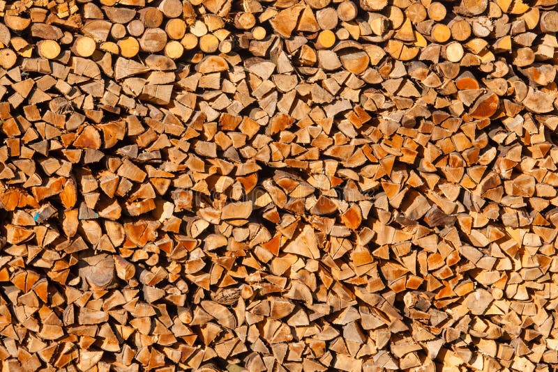 Renewable heat energy resource, cut down, split and piled logs forestry background texture pattern abstract. Renewable heat energy resource, cut down, split and piled logs forestry background texture pattern abstract