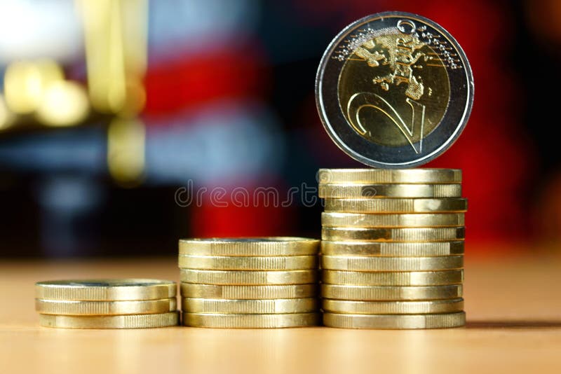 Piles of coins on a table stock photo. Image of profit 89802320