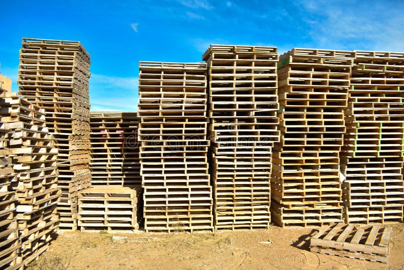 Piles of european pallets made in wood ready to be used transporting products or goods on them from a place to other by truck