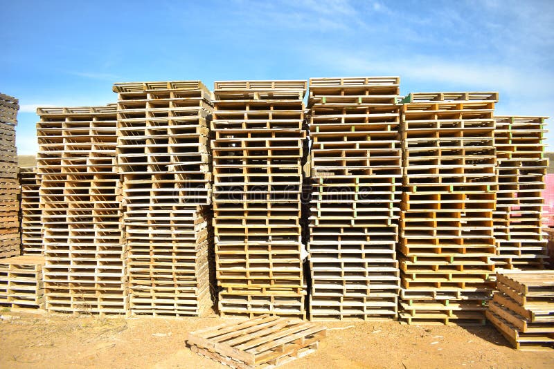 Piles of european pallets made in wood ready to be used transporting products or goods on them from a place to other by truck