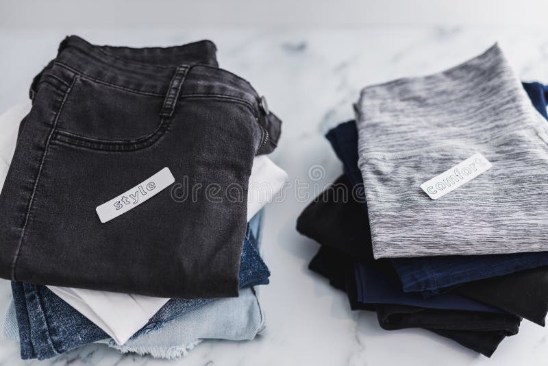 Piles of Jeans and Pants Being Sorted into Style Vs Comfort Categories, Decluttering and