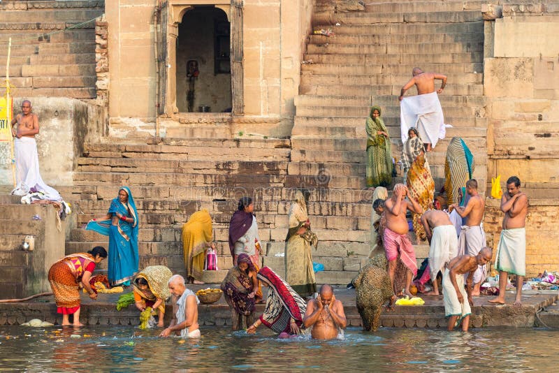 Pilgrims Bathing In The Ganges River In Varanasi Uttar Pradesh India