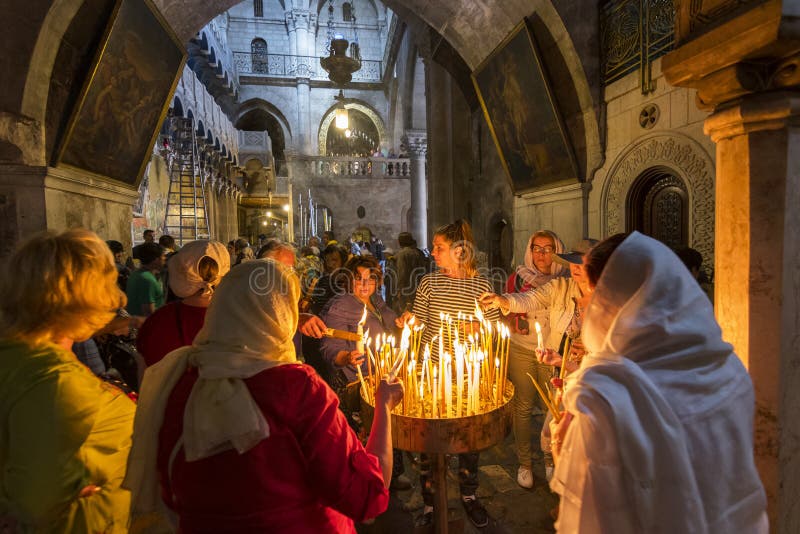 The pilgrims lit candles, Church of the Holy Sepulchre in Jerusalem, Israel.