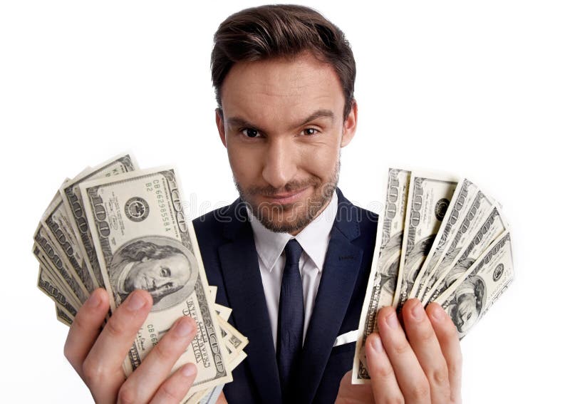 pilha da terra arrendada do homem de negócios de dinheiro do dólar em suas mãos imagem de stock royalty free pilha da terra arrendada do homem de negócios de dinheiro do dólar em suas mãos imagem de stock royalty free