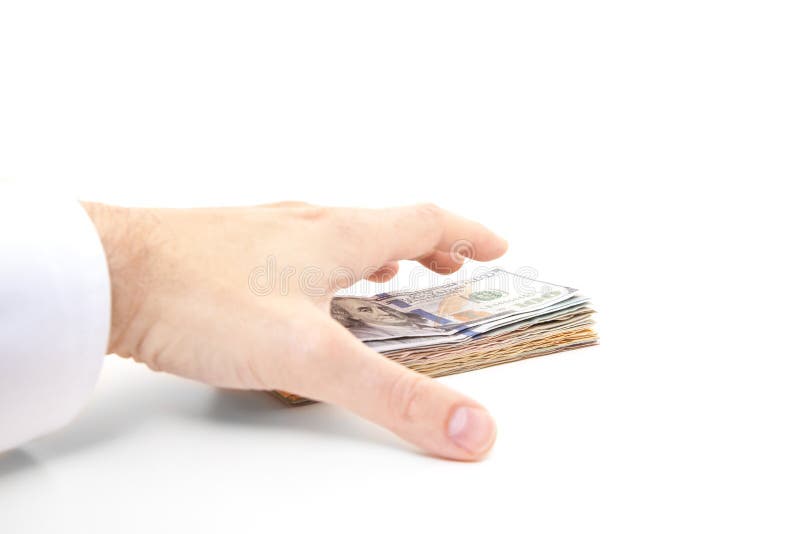Pilha de agarramento da mão de notas do dólar fotografia de stock Pilha de agarramento da mão de notas do dólar fotografia de stock