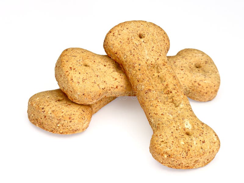 Pile of bone-shaped dog biscuits, isolated on white background. Pile of bone-shaped dog biscuits, isolated on white background