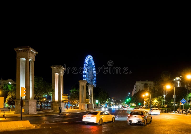 The Pillars of the Harbour Entrance with Ferris Wheel in the Background