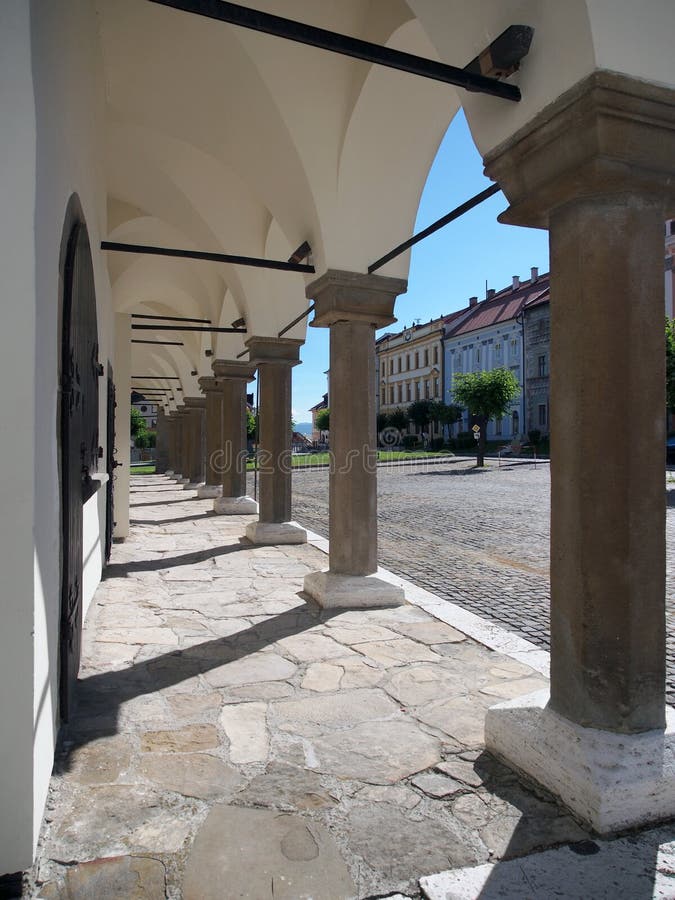 Pillars of Levoca's townhall arcade. Summer view portraying historic arcade located at townhall of medieval Levoca town, in Spis region, north-eastern Slovakia stock photography Pillars of Levoca's townhall arcade. Summer view portraying historic arcade located at townhall of medieval Levoca town, in Spis region, north-eastern Slovakia stock photography