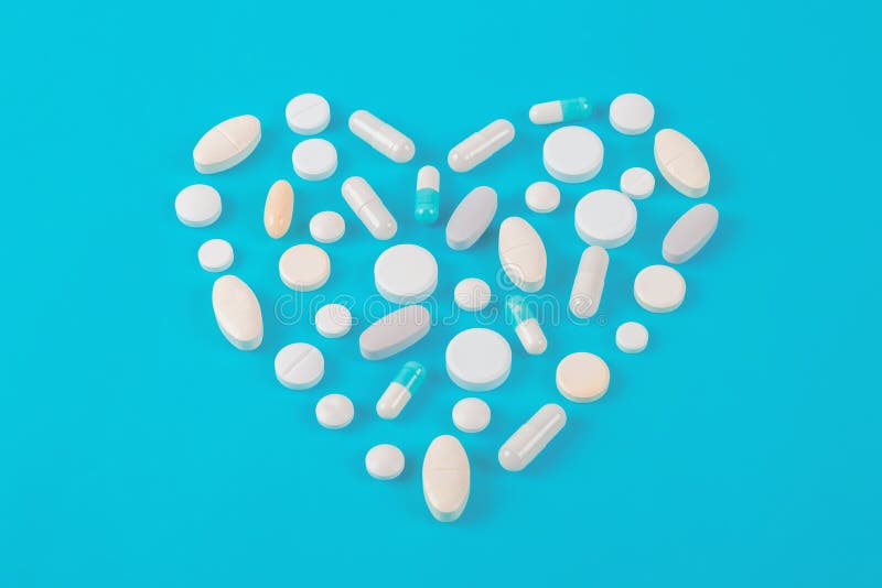 Pillole farmaceutiche assortite, compresse e capsule della medicina sopra fondo blu immagine stock Pillole farmaceutiche assortite, compresse e capsule della medicina sopra fondo blu immagine stock