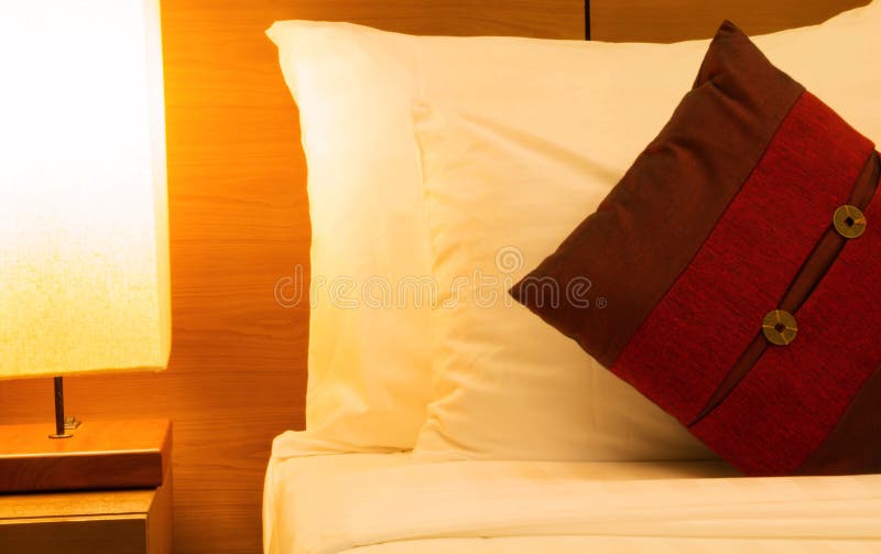White Lumbar Pillow on a Bed, Case Mockup. Interior Photo Stock Image