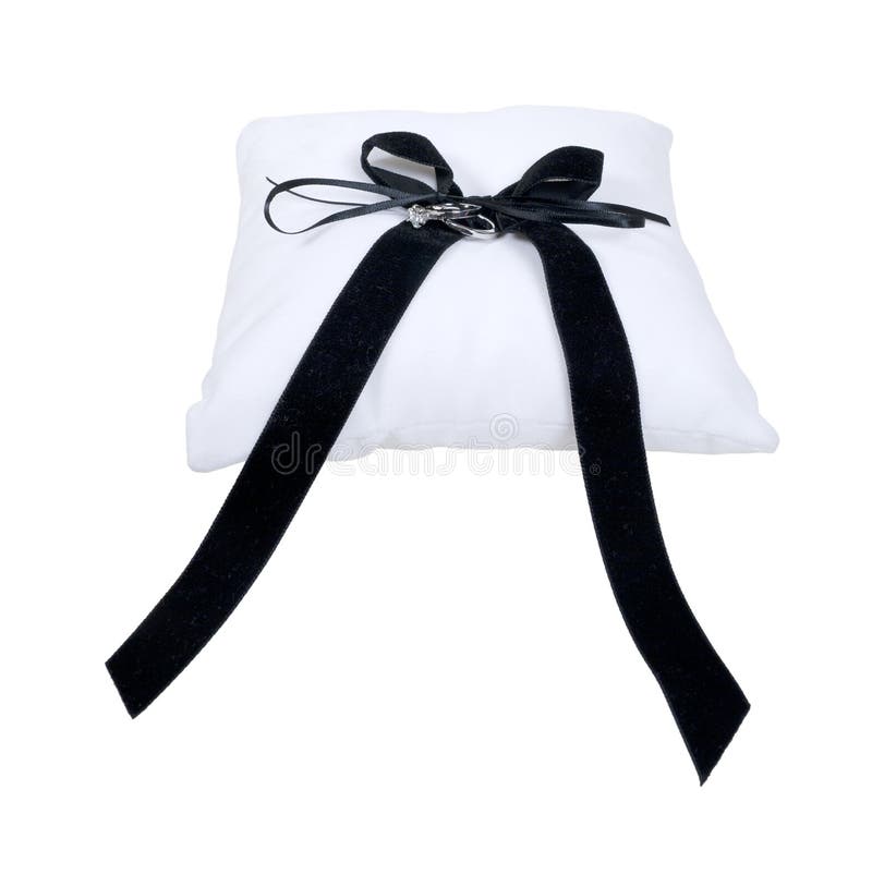 Pillow and Wedding Rings royalty free stock image