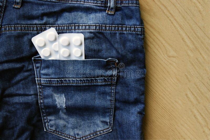 Pills in the back pocket of jeans.