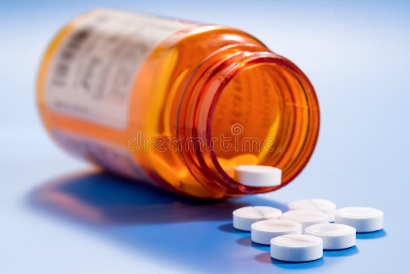 Pills in a bottle stock photos