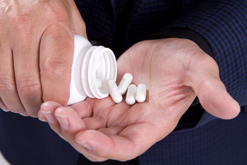 Pills Bottle Hands stock photo