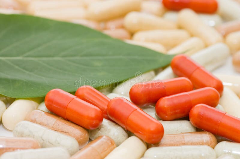 Pills on green sheet royalty free stock photos