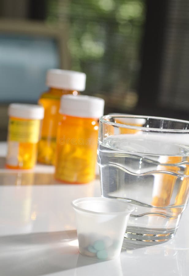 Pills in Medicine Cup with Water Glass Stock Photo Image of drink