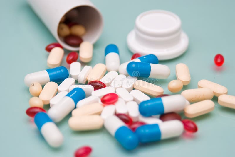 Pills and opening bottle royalty free stock photos