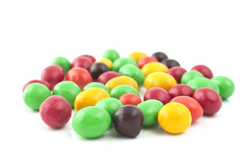 Pills with peanuts covered with multicolored glaze