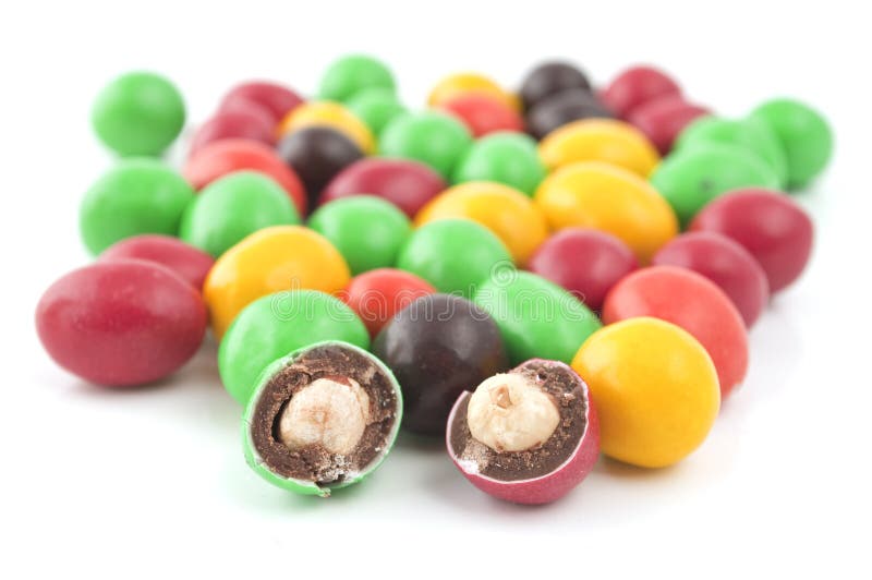 Pills with peanuts covered with multicolored glaze