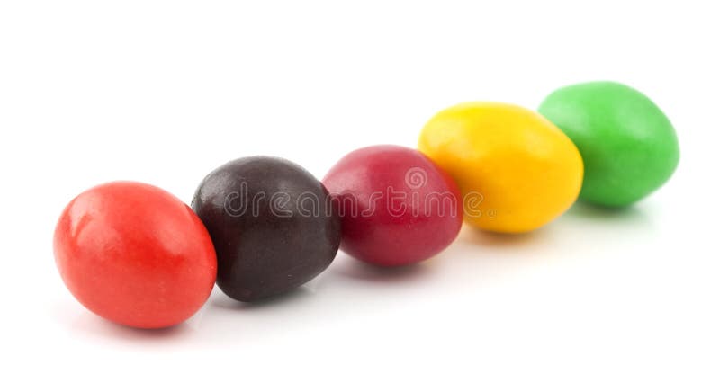 Pills with peanuts covered with multicolored glaze