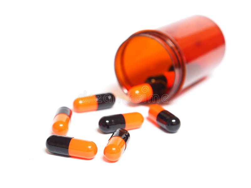 Pills Spilling Out of a Pill Bottle on White Stock Image Image of