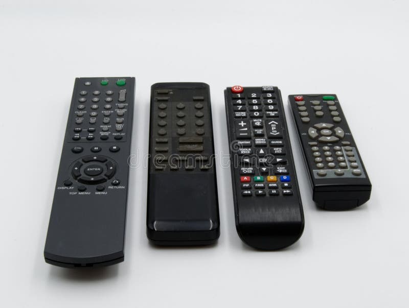 Piloci do TV na stole zdjęcia royalty free Piloci do TV na stole zdjęcia royalty free