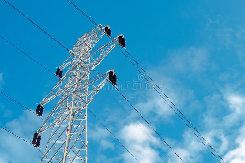 Electricity pylon in snow, winter scenery with lonely pole for power transmission. Electricity pylon in snow, winter scenery with lonely pole for power transmission