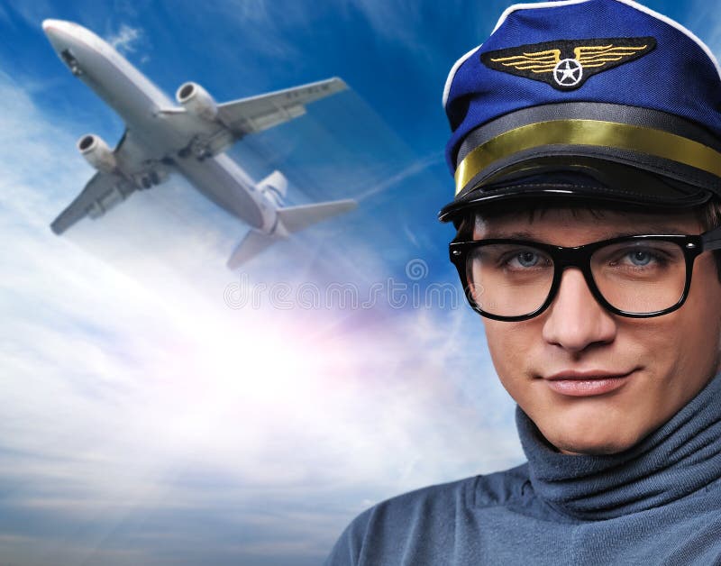 Pilot against flying plane stock image Pilot against flying plane stock image