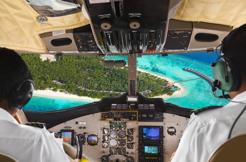 Pilots in the plane cockpit and island stock photo