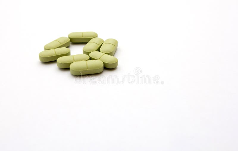 Pilules vertes sur un fond blanc photo stock Pilules vertes sur un fond blanc photo stock