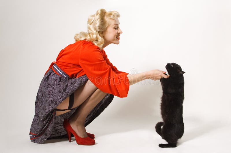 Pin-up girl with black cat stock photography Pin-up girl with black cat stock photography