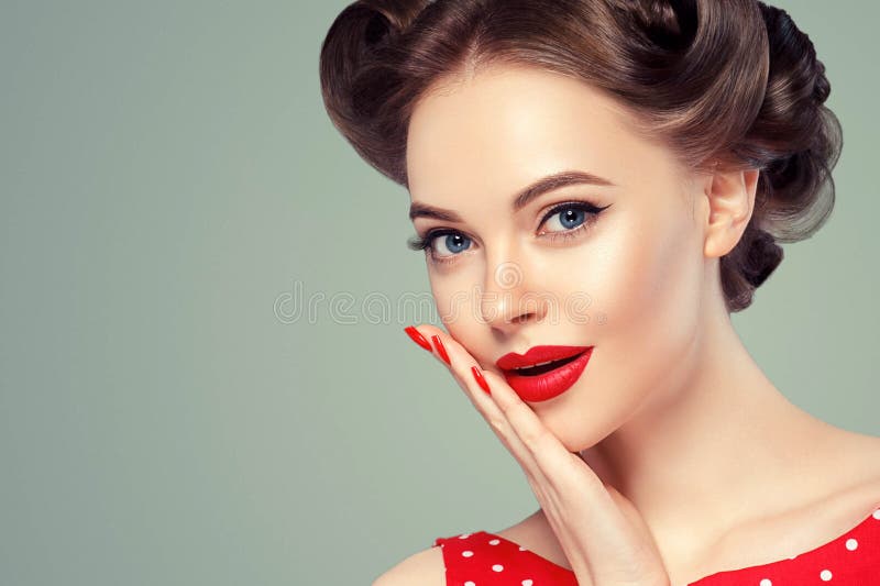 Pin up girl vintage. Beautiful woman pinup style portrait in retro dress and makeup, manicure nails hands, red lipstick and polka