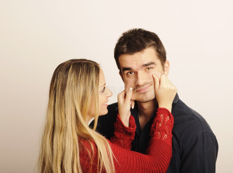 Pinching cheeks stock image. Image of couple, funny, young 33440955