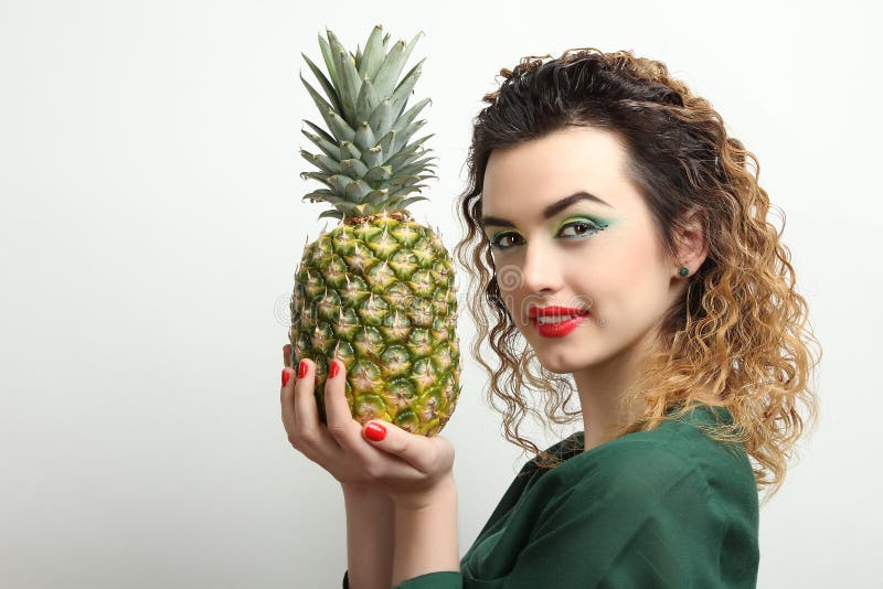 Girl with pineapple stock photo. Image of curly, model 90852906